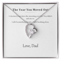 Silver heart pendant necklace on a printed message card reading The Year You Moved Out, signed Love Dad, in a white gift box