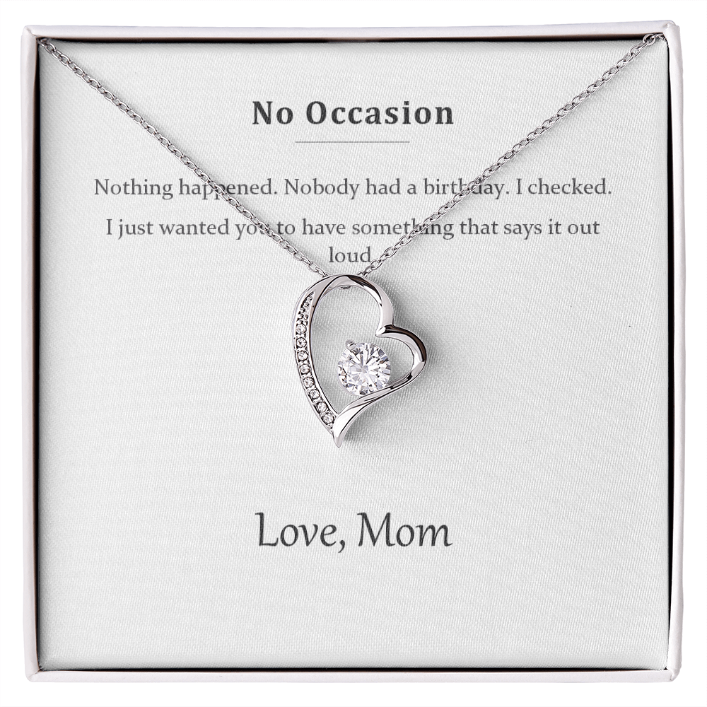 Silver heart pendant necklace on a printed message card reading No Occasion, in a white gift box