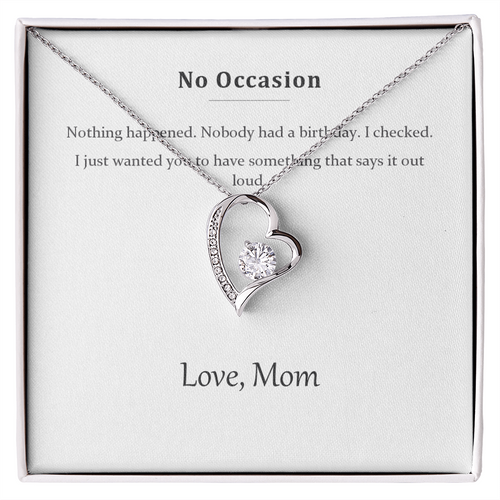 Silver heart pendant necklace on a printed message card reading No Occasion, in a white gift box