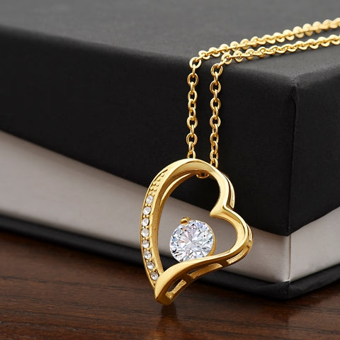 The pendant in both finishes side by side - 14k white gold and 18k yellow gold